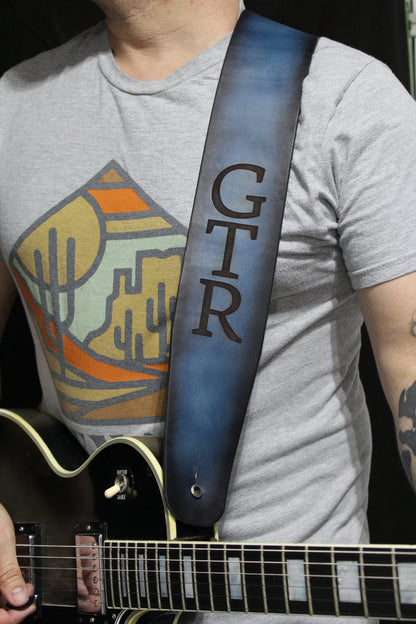 Blue leather guitar strap